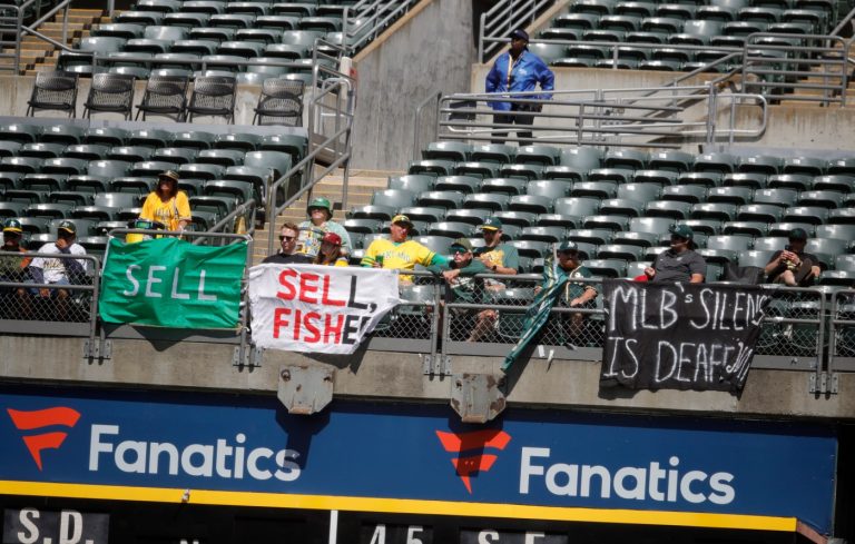 “SELL” flag behind home plate makes brief late-game TV appearance before A’s fan removed